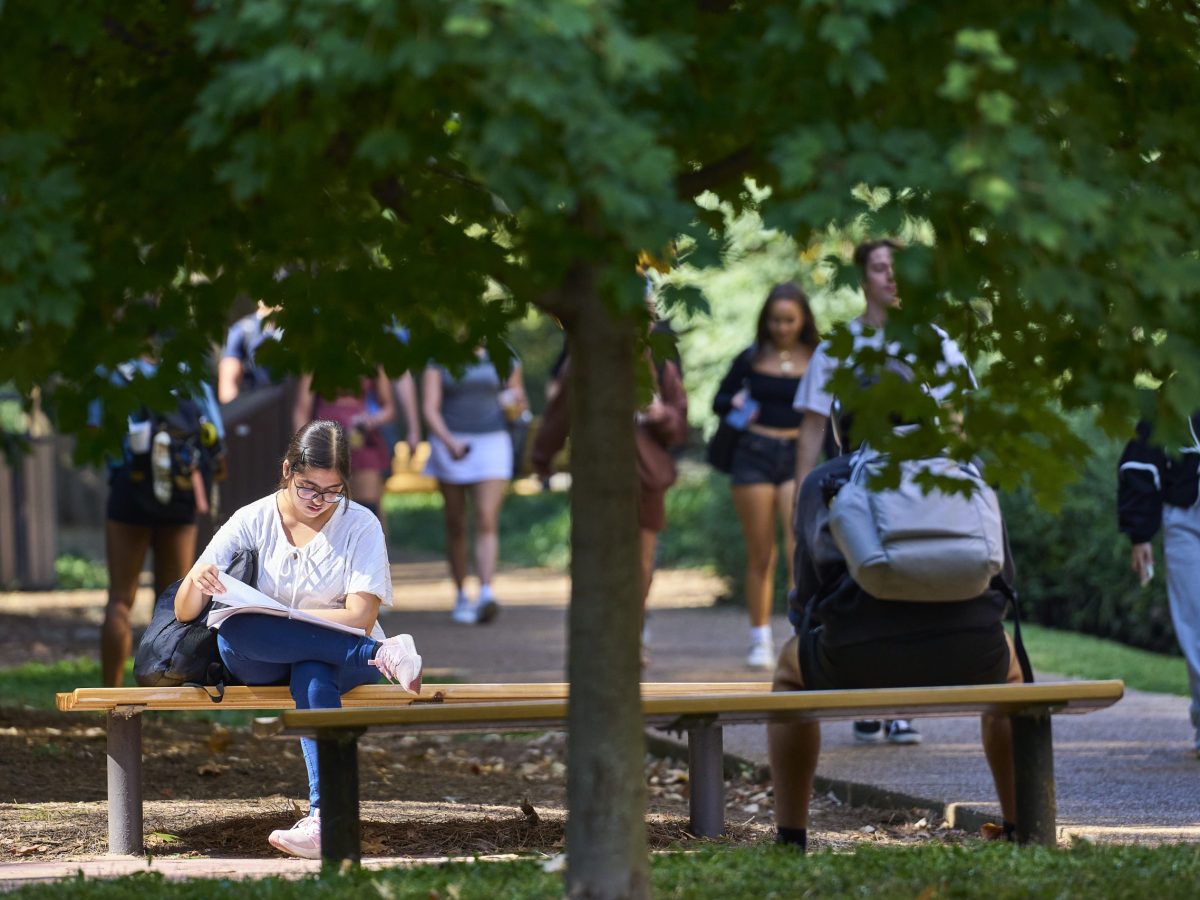 Guy sit guy sitting on a bench 