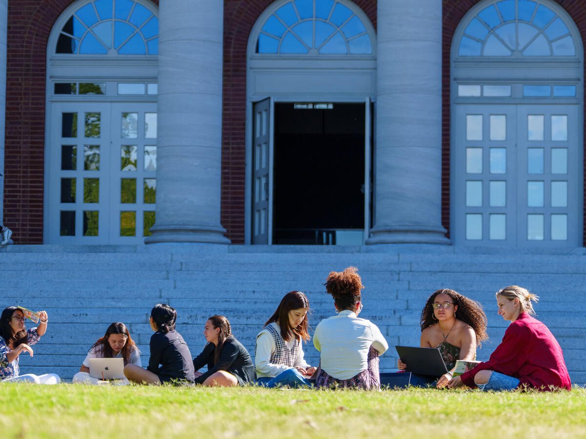 students sitting outside