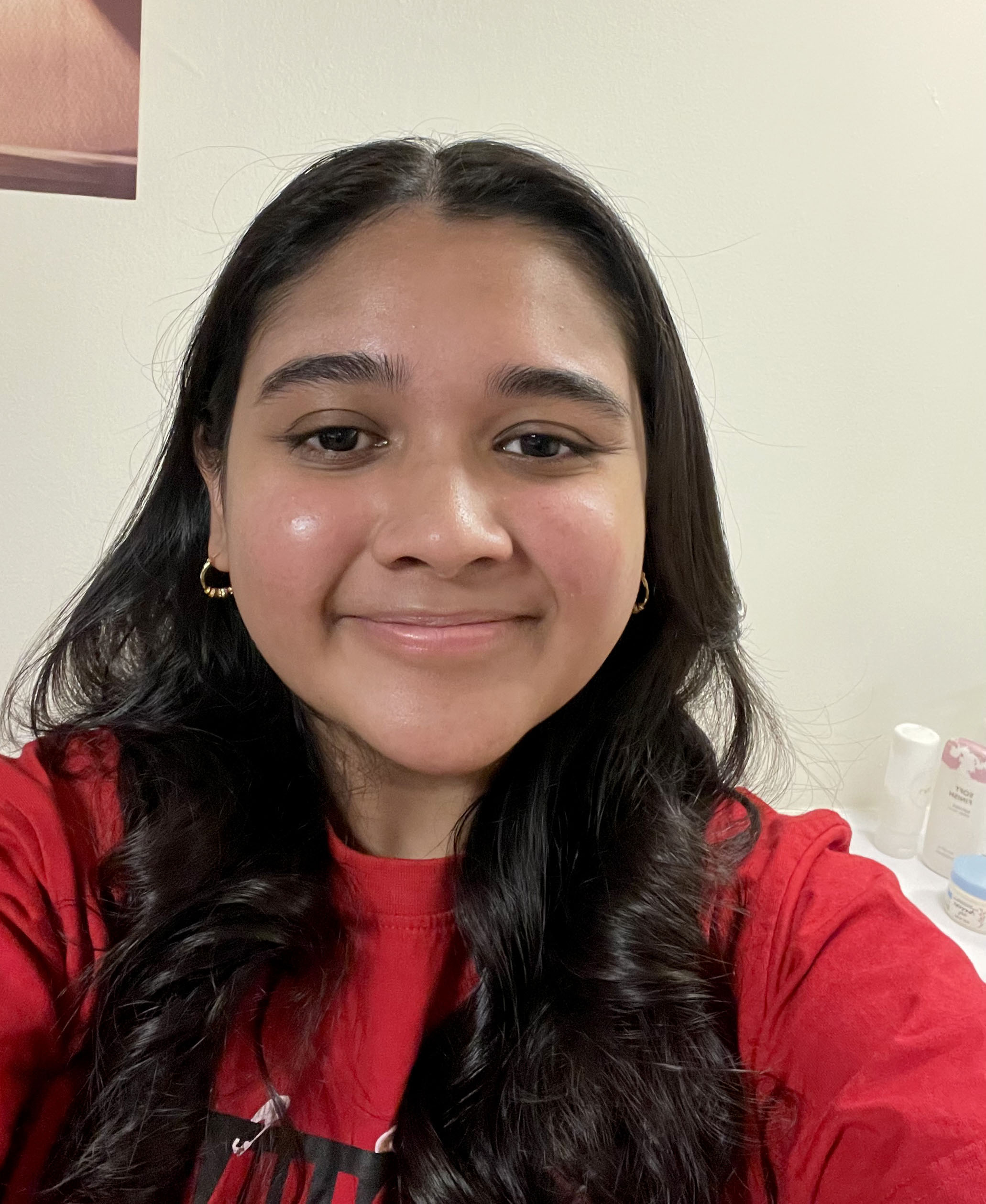 smiling young woman with long dark hair