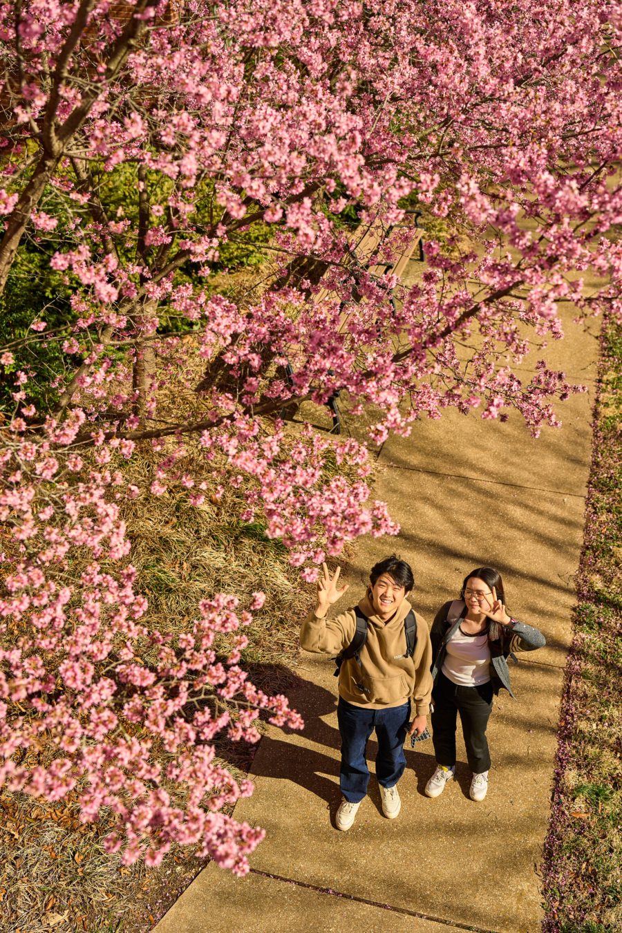 students waving at camera